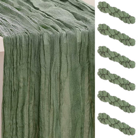 SuBleer sage green cheesecloth table runner on a formal dining table.