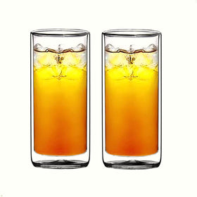 Sun's Tea two-glass Collins set on bar counter showcases 16oz capacity for versatile drinks.