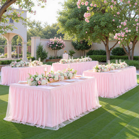 Suppromo baby shower decoration enhances pink theme with elegant drape.