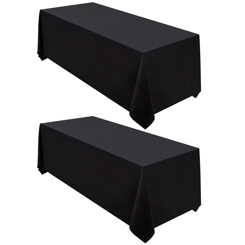 Surmente 2-pack black tablecloth with 90x132 full coverage on rectangular tables.