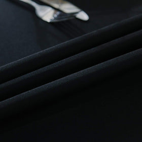 Surmente banquet setup with black tablecloth creating a professional event display.