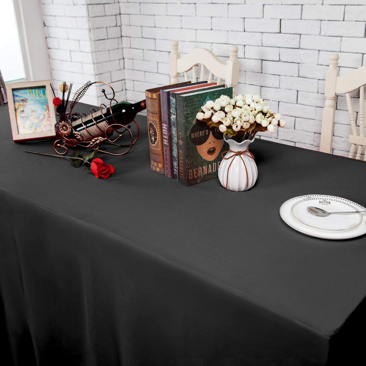 Surmente wedding setup with black 6ft tablecloth; elegant backdrop.