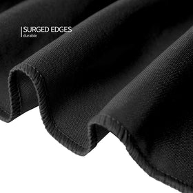 Wedding table setup with Surmente black fitted tablecloth for elegant ambiance