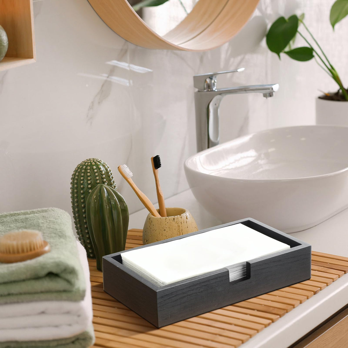 Suzile two-pack black wooden towel holder in use in a hotel bathroom setting.