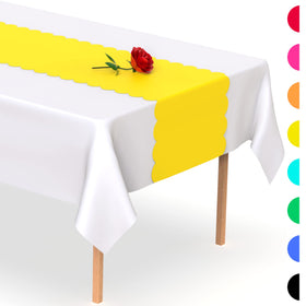 Swanoo yellow table runner shown with glasses and centerpieces