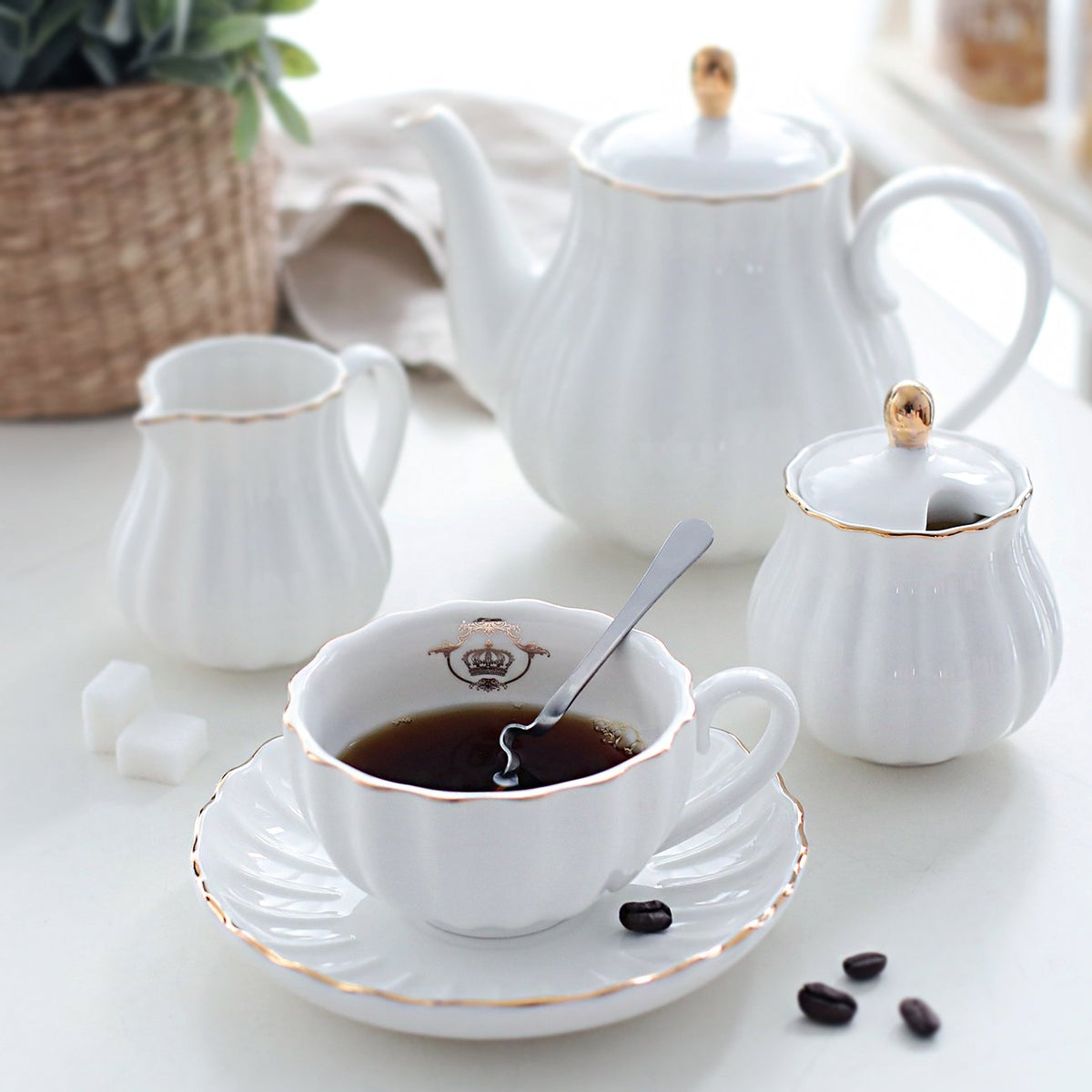 Sweejar teapot, sugar bowl, cream pitcher, and strainer for complete tea time
