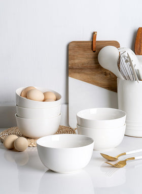 Sweese white bowls on table, versatile for soup, salad, or oats.