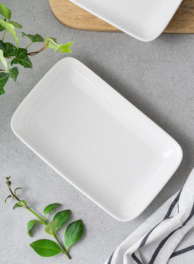 Sweese 6-piece white serving plates arranged for display.
