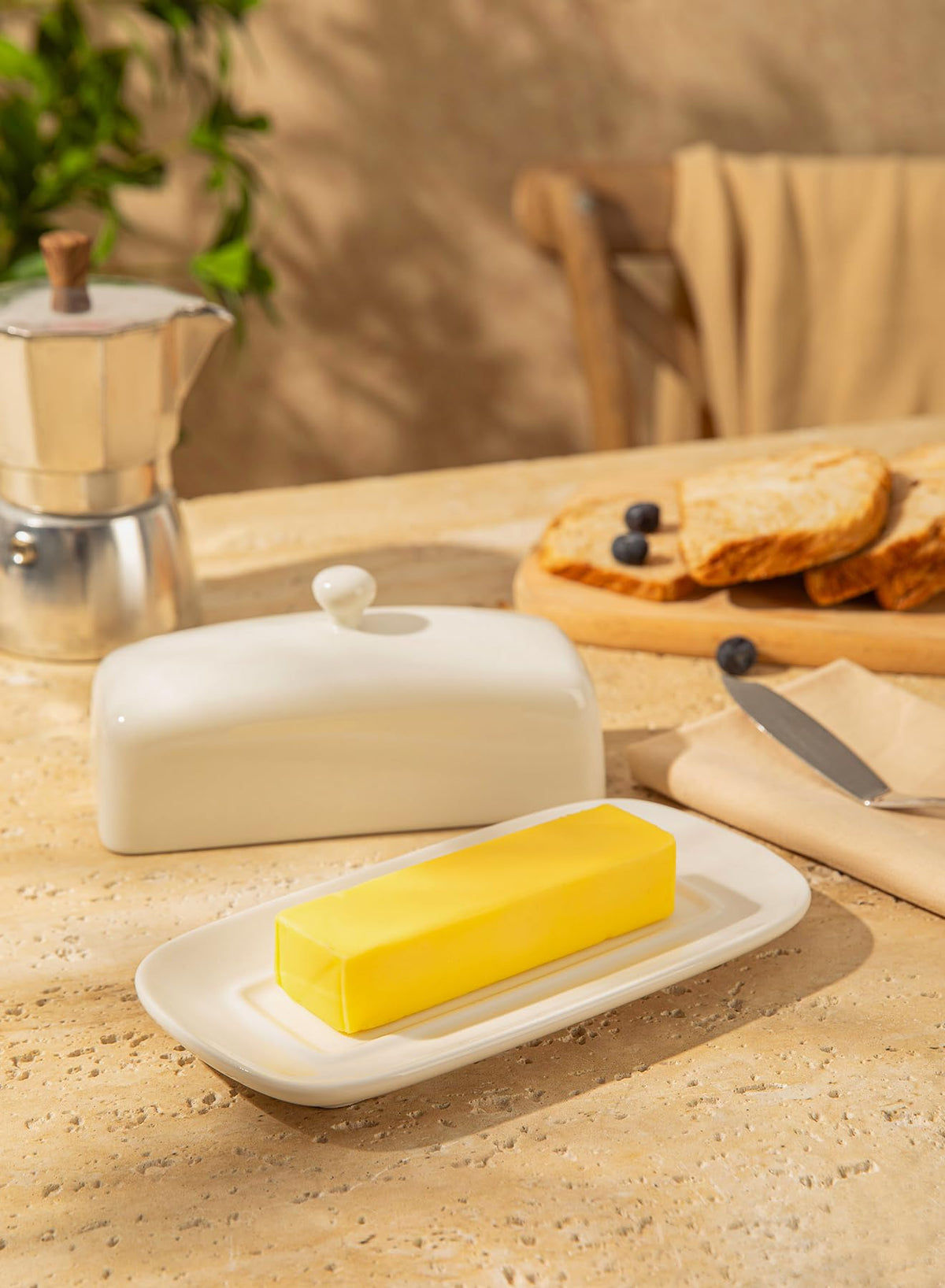 Sweese porcelain butter keeper inside fridge, compact and organized.