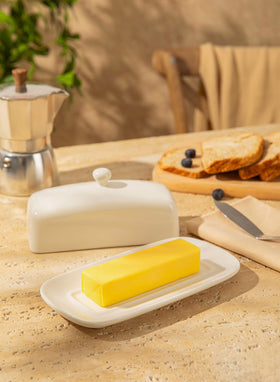 Sweese porcelain butter keeper inside fridge, compact and organized.