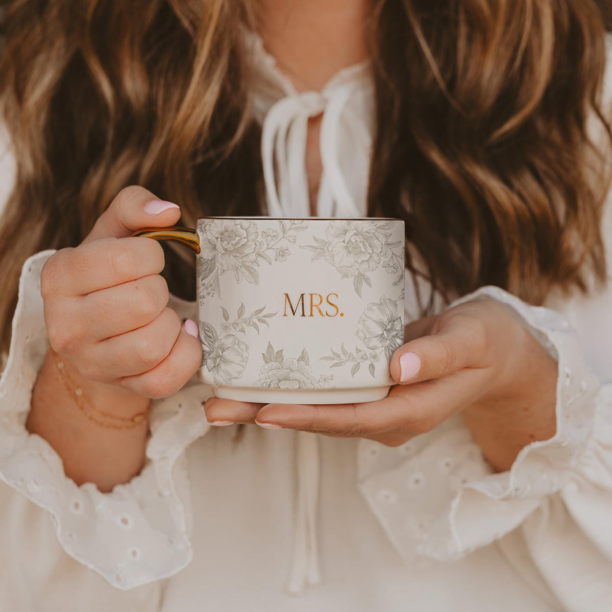 Designed in the USA, fine bone china offers a graceful pattern and comfortable handle.