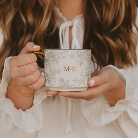 Designed in the USA, fine bone china offers a graceful pattern and comfortable handle.