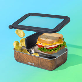 S'well Bento Box Teakwood fits in backpacks beside everyday essentials.