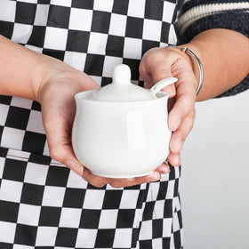 Swetwiny sugar bowl with glazed white ceramic finish fits any decor.