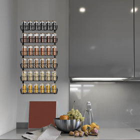 Wide basket bottom stores large jars and cans with stability.