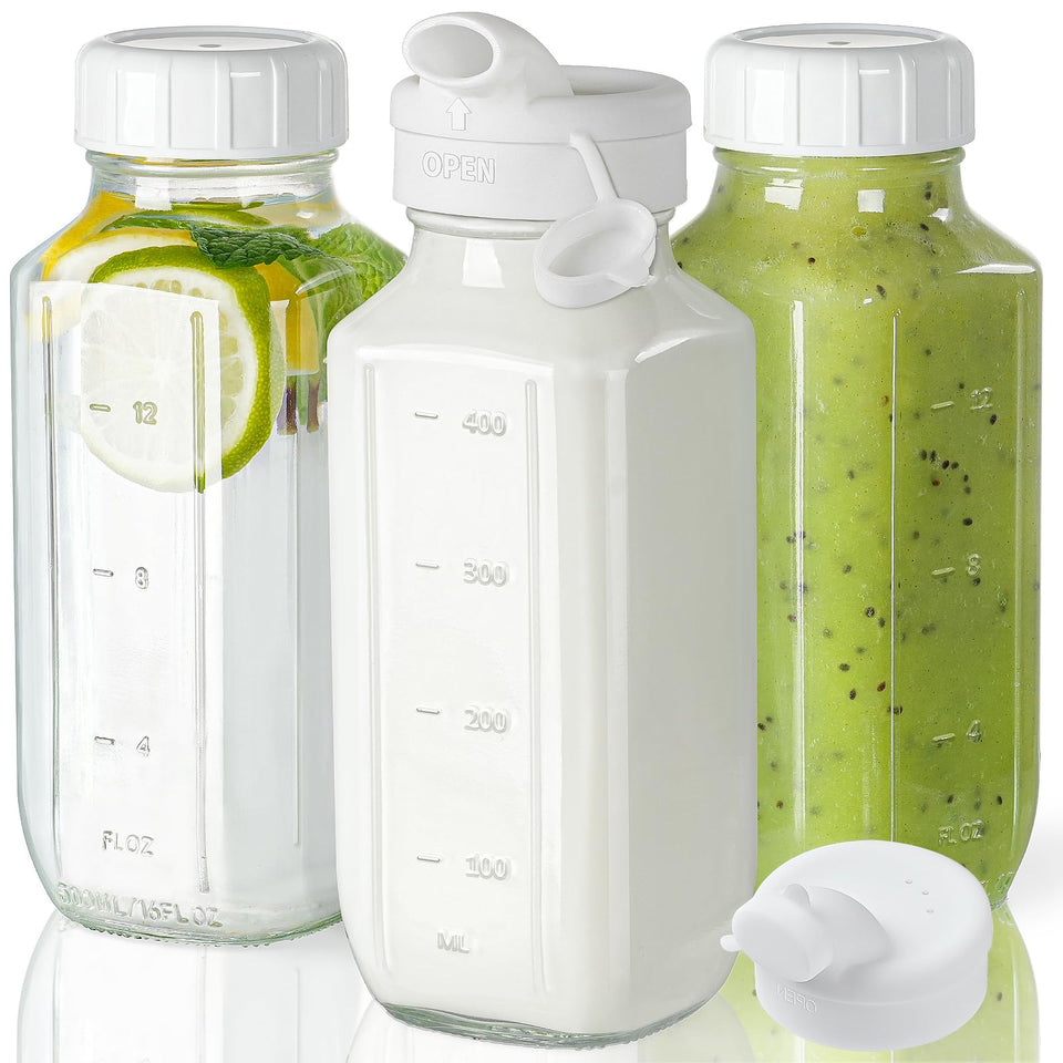 Syntic clear glass juice bottles with lids for travel and storage.