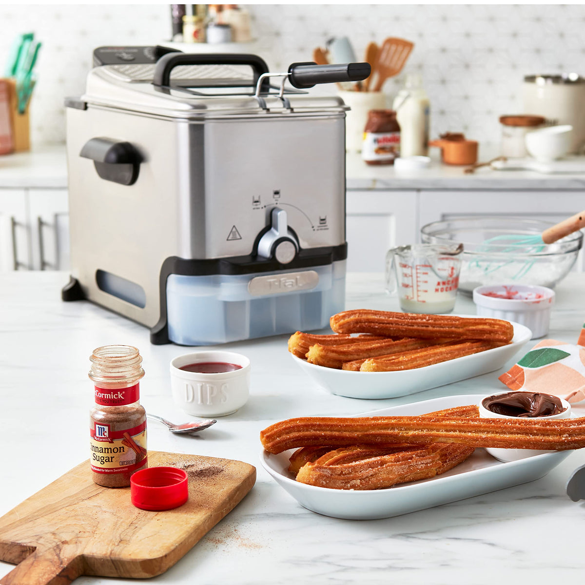 T-Fal cool-touch handles keep hands safe during handling.