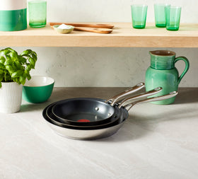 Riveted stainless steel handles provide secure grip.
