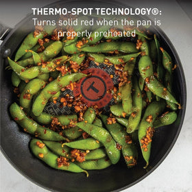 Riveted silicone handles provide a comfortable grip during cooking and transfers.