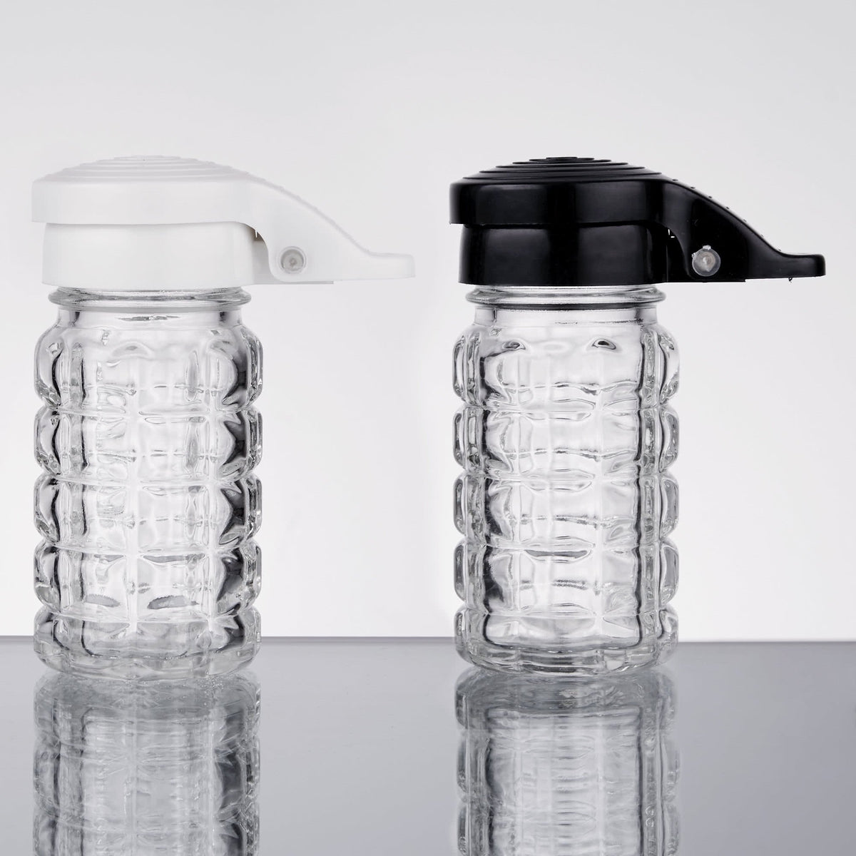 Tablecraft salt and pepper shakers in clear glass for visibility.