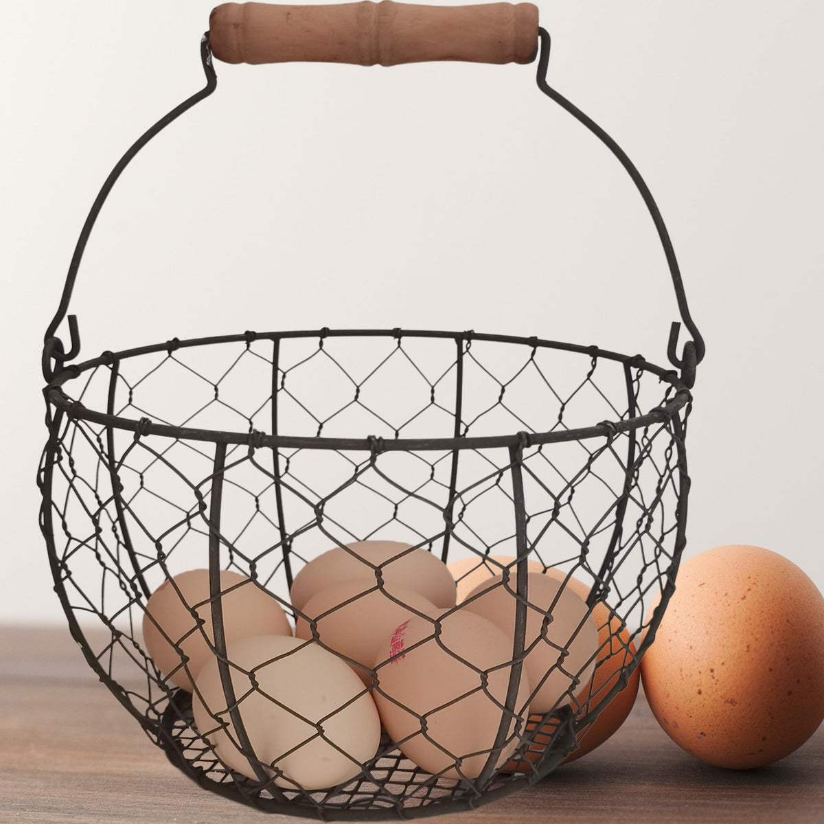 TAIANLE farmhouse wire egg basket with handle for easy coop-to-countertop egg transport.