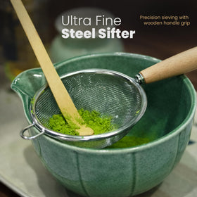 Taiba Essentials matcha sifter with wooden handle for clump-free mixing.