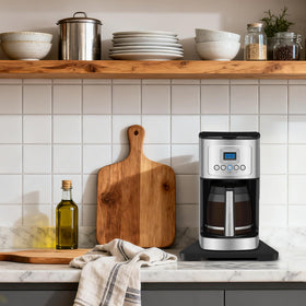 Taladad espresso and air fryer setups supported by the bamboo tray.