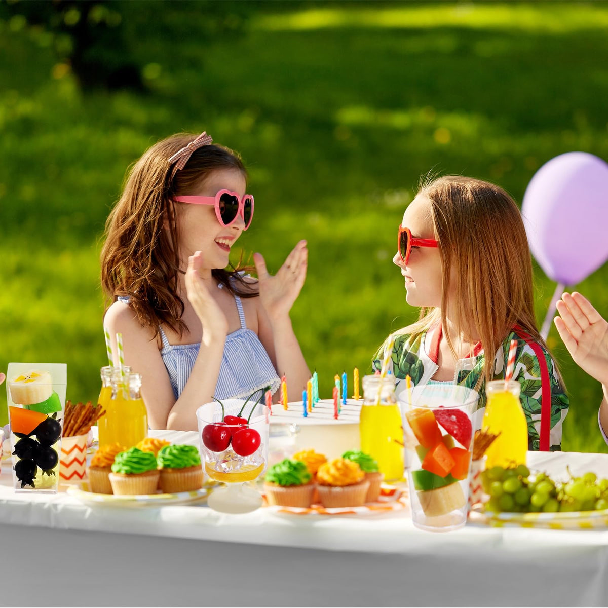 Tanlade dessert cups set on a party table showcase desserts beautifully.