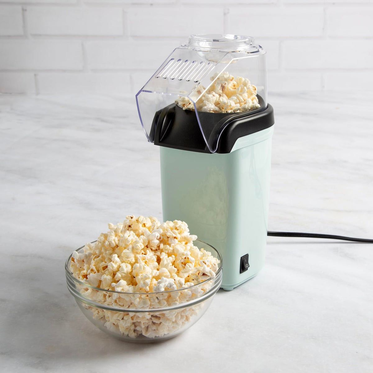 Tasty hot air popcorn popper aqua dorm kitchen scene emphasizes space-saving convenience.