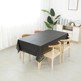Tatibana birthday party tablecloth in black and gold adds festive charm.