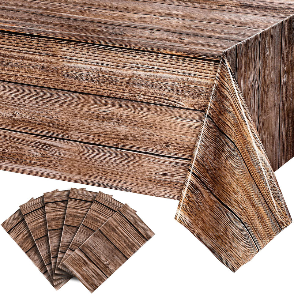Tatuo wood grain tablecloth in natural brown protects 54x108 inch tables with rustic charm.
