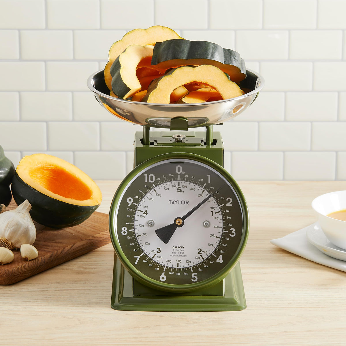 Taylor Analog Scale sits on a kitchen countertop with retro charm.