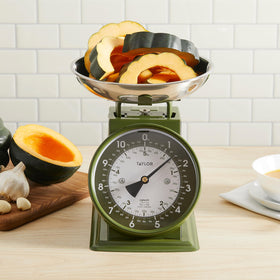 Taylor Analog Scale sits on a kitchen countertop with retro charm.