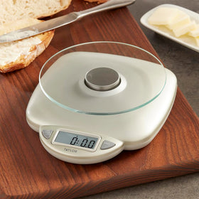Taylor scale shows grams and ounces for versatile meal prep.
