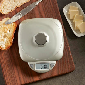 Taylor tempered glass platform supports easy cleaning and stable weighing.