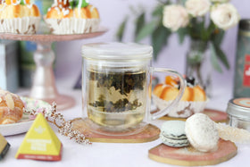 Teabloom double-walled tea mug keeps beverages hot or cool to the touch.