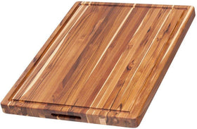 Teakhaus large cutting board with juice groove for mess-free carving and serving.