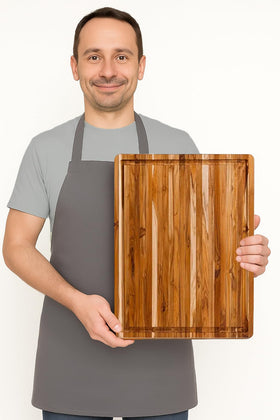 Teakhaus reversible cutting board doubles kitchen space for versatile prep.