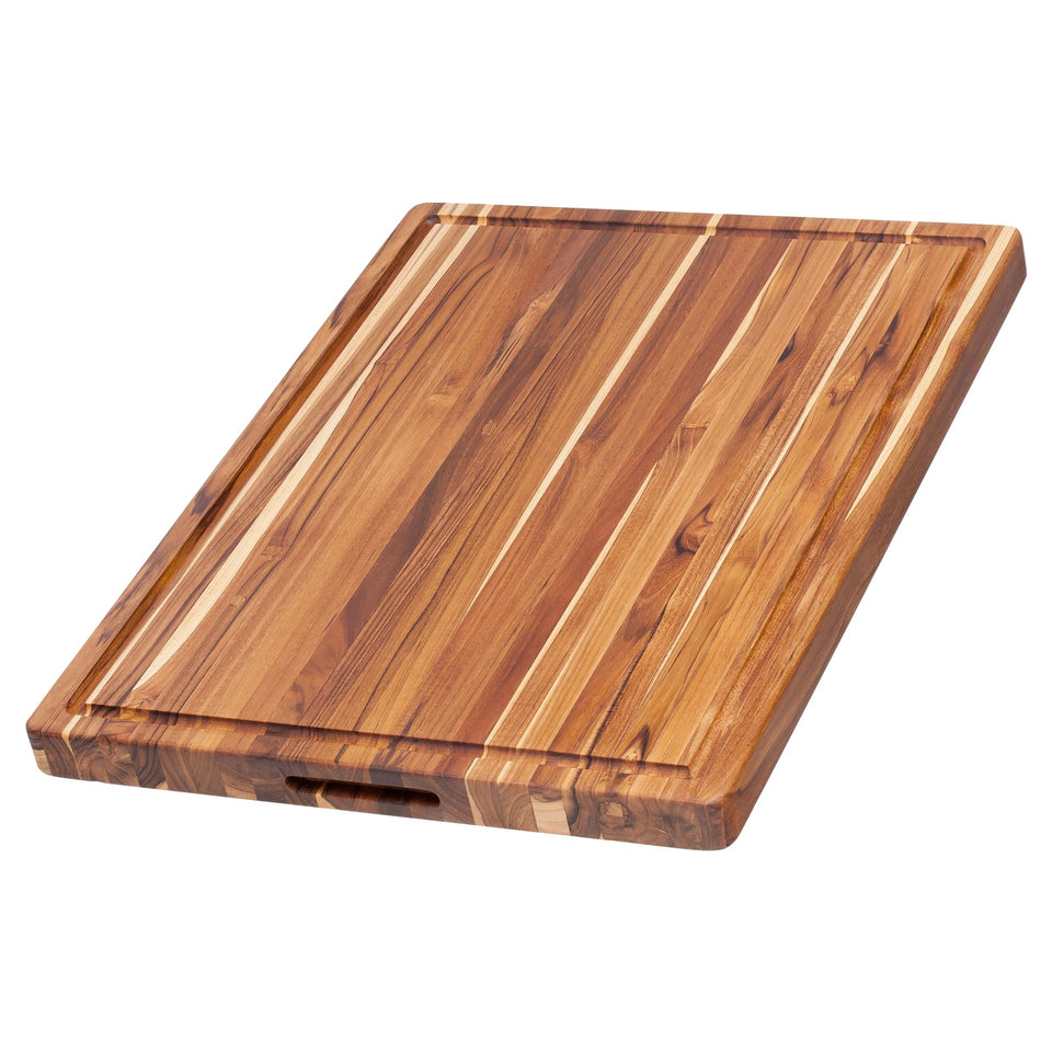 Teakhaus XL cutting board with juice groove for contained juices during carving