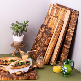 Teakhaus small cutting board with reversible design doubles prep surface.