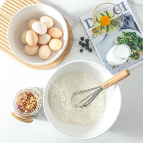 TEAKISS white glaze ceramic mixing bowl close-up showing smooth surface.