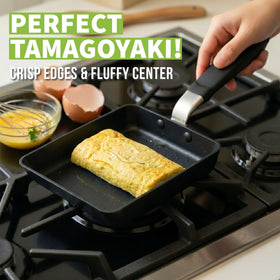 TECHEF Tamagoyaki Pan rolled-egg angle showing precise rolling and smooth release