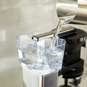 Moccamaster KBGV Select glass carafe on the warming plate for viewing the brew.