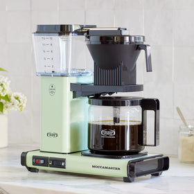 Technivorm Moccamaster KBGV Select pistachio-green kitchen setup with color and reliability.