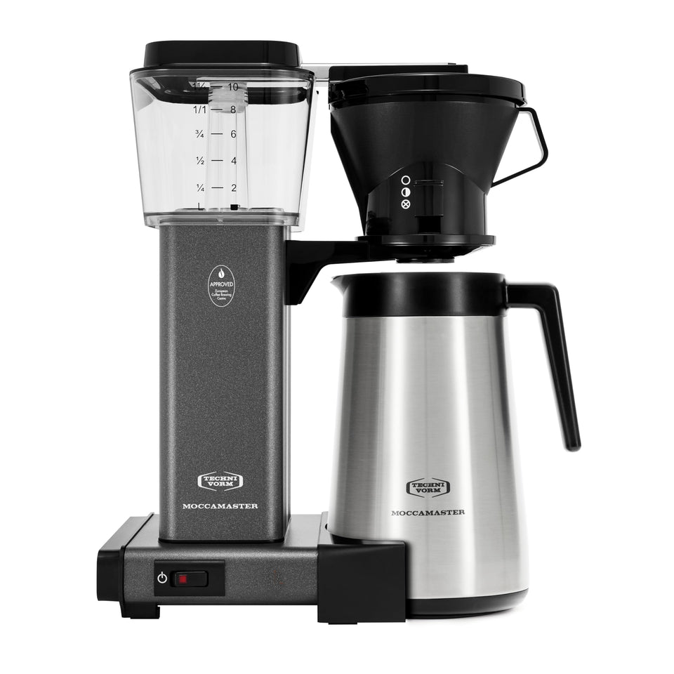 Technivorm Moccamaster KBT Stone Grey brewing setup with a thermal carafe for hot coffee.