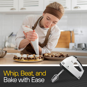 TechnoLegend hand mixer in-use with bowl shows smooth batter results.