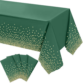 Tegeme green and gold tablecloth 4-pack on a table, party-ready style.