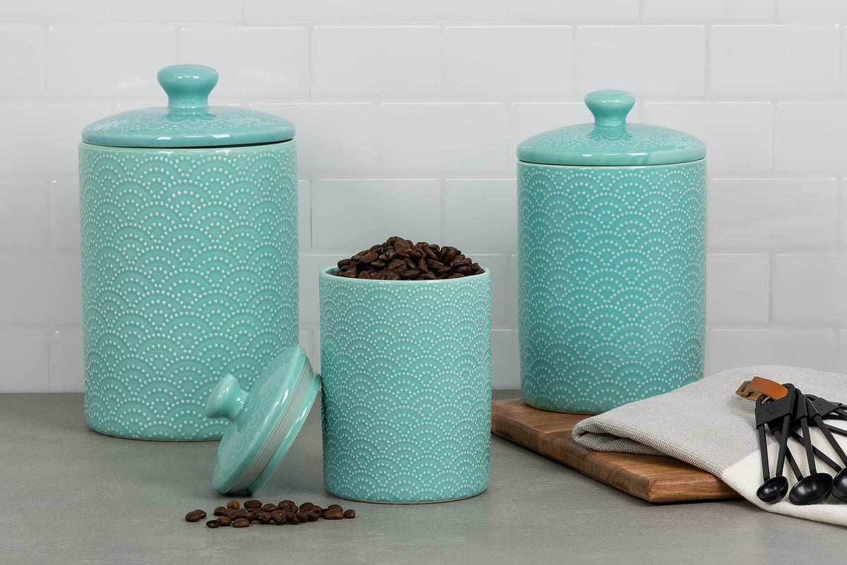 Ten Strawberry Street embossed ceramic medium canister in Tide Blue stores sugar neatly on a shelf.