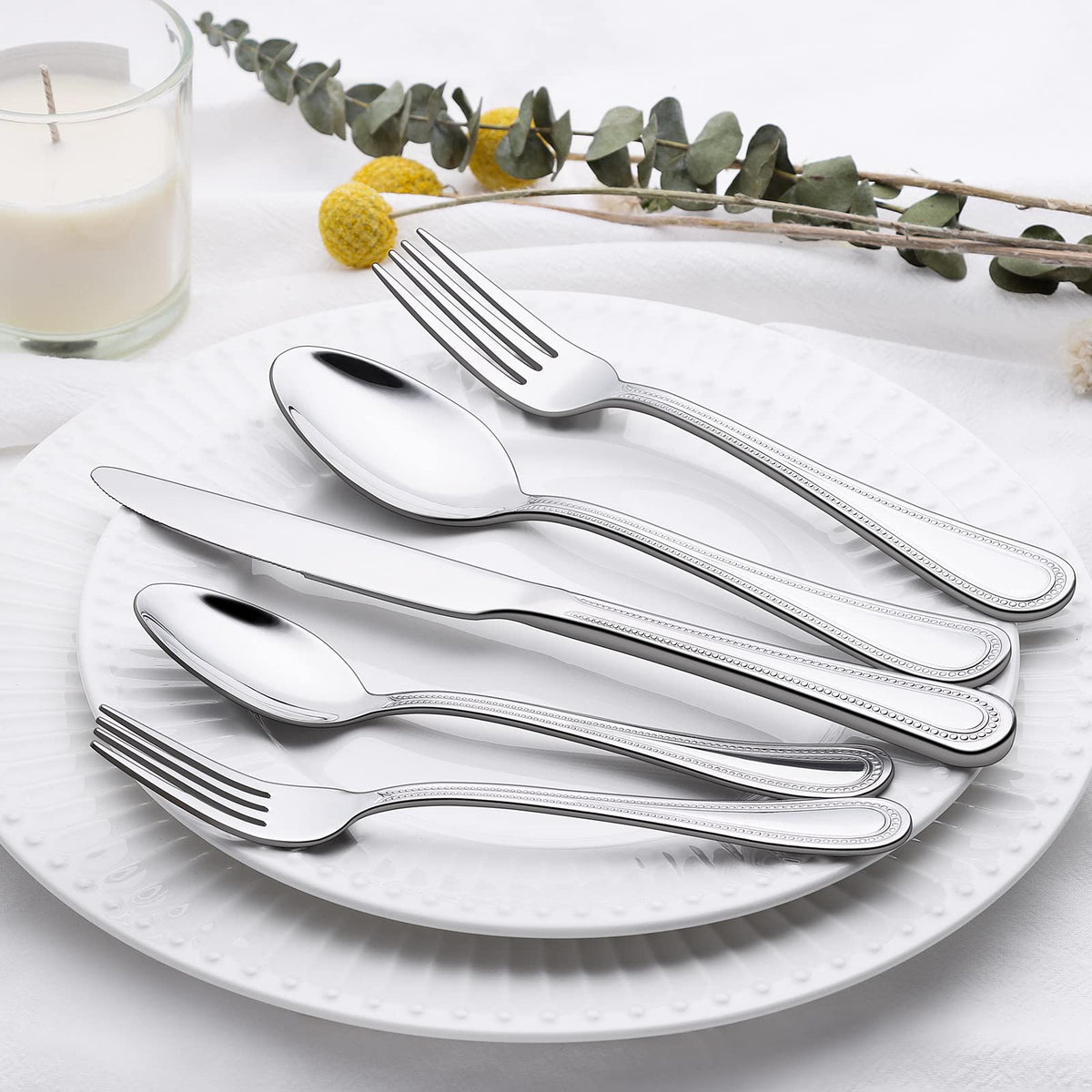 Terlulu mirror-polished finish enhances any table with a premium look.