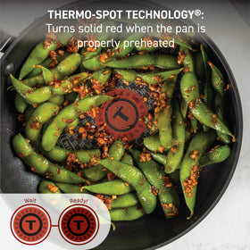 T-Fal Ultimate hard anodized 11.5-inch covered frypan reduces mess while cooking.